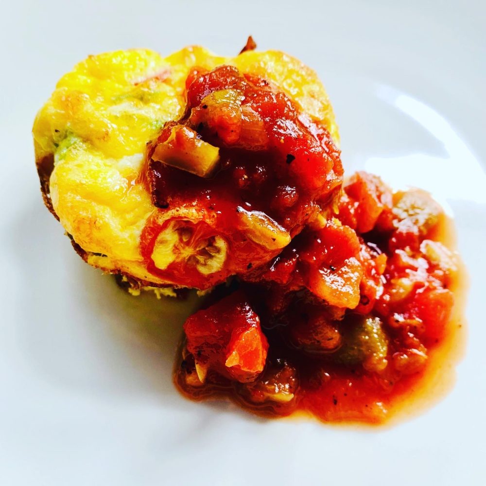 easy baked eggs on a plate with salsa on top